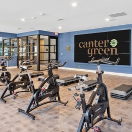 fitness center with open spaces and bright lighting through the windows
